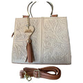 White Trapezoidal Bag with Metal Handles and Engraved Details