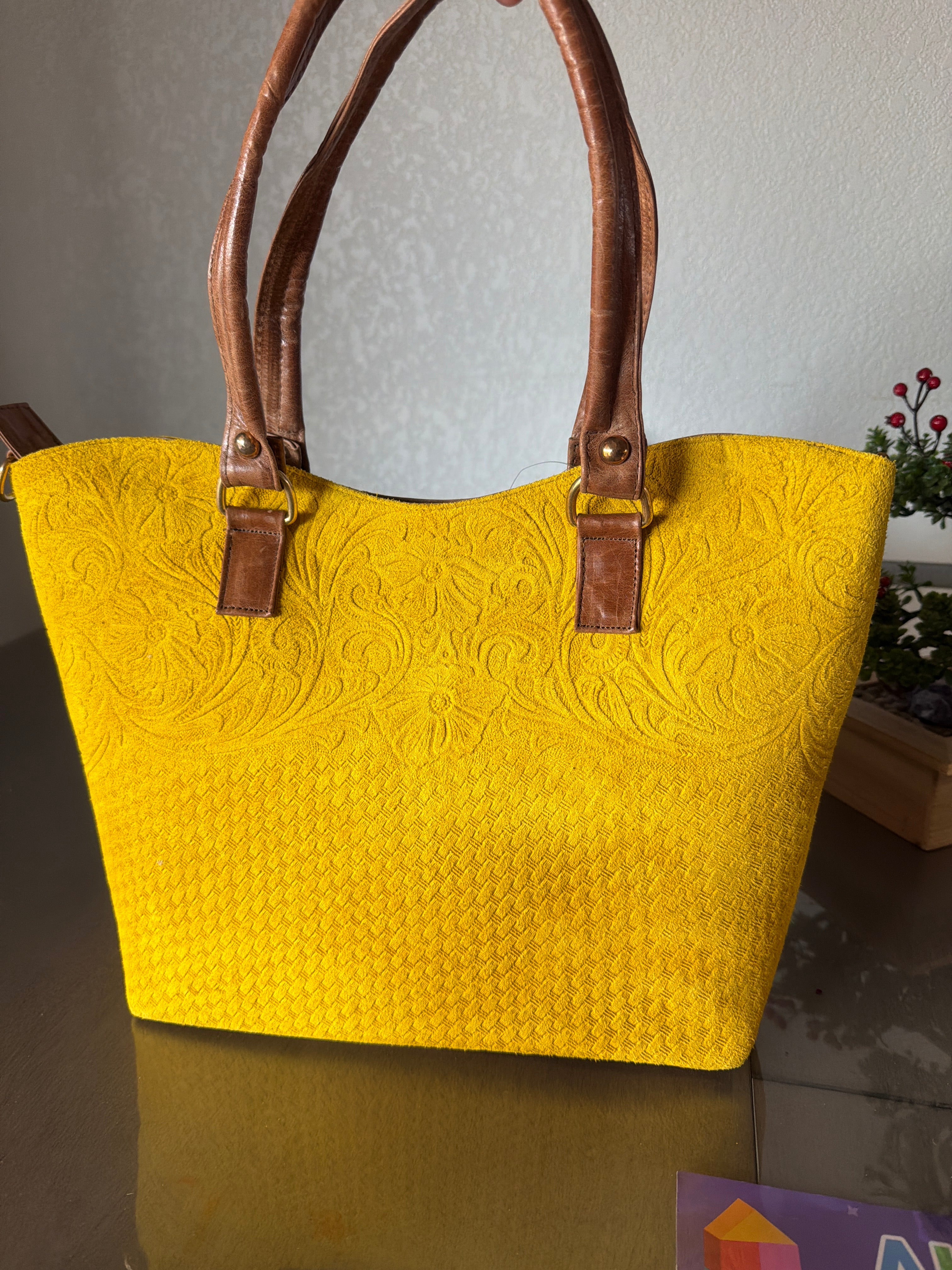 Tote the leather