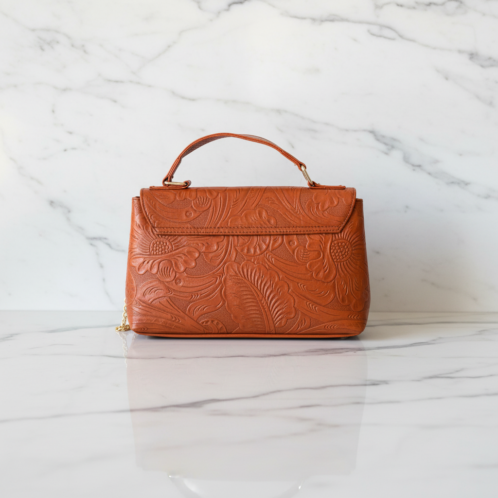 Bolsa coñac atrás - fondo mármol